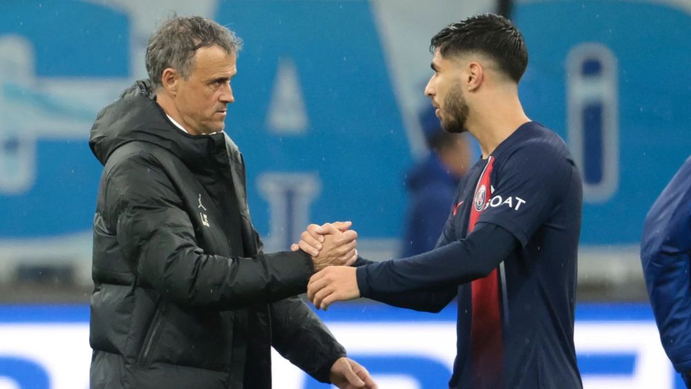 Luis Enrique y Marco Asensio, saludándose tras un partido del PSG. Luis Enrique y Marco Asensio, saludándose tras un partido del PSG.