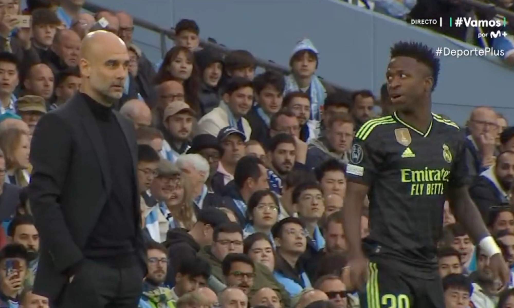 Pep Guardiola, junto a Vinicius Junior, durante uno de los enfrentamientos últimos en Champions entre Manchester City y Real Madrid.