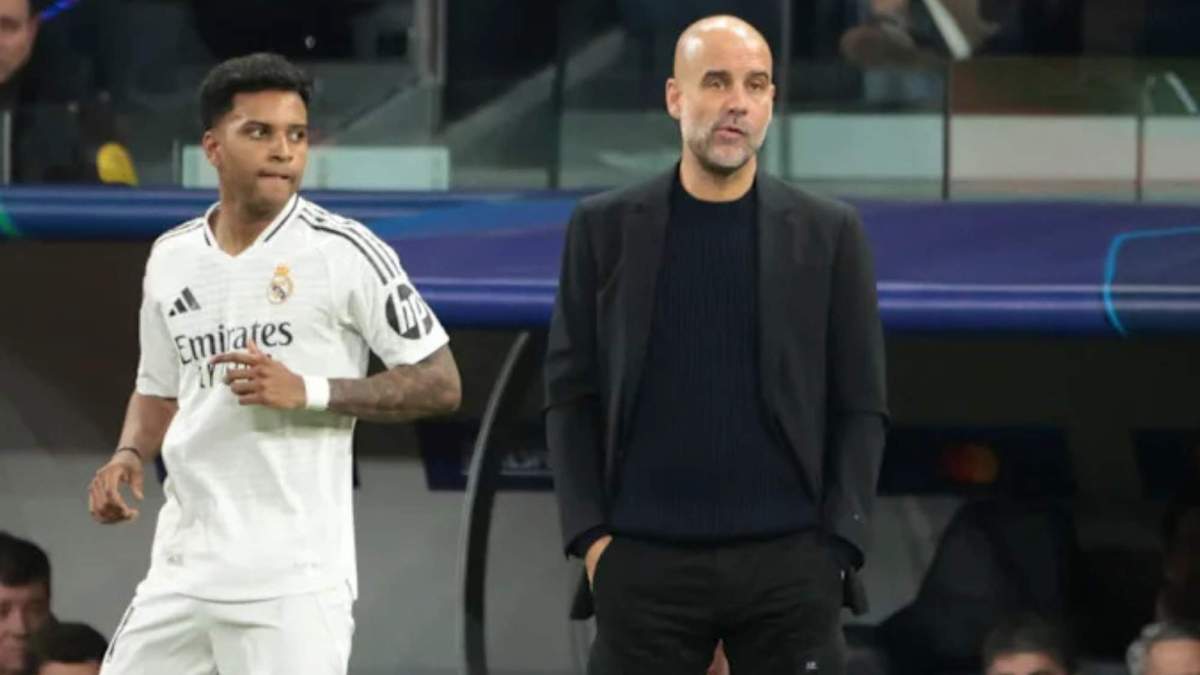Rodrygo y Guardiola durante un Real Madrid City